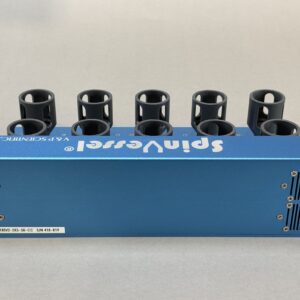 Blue metal lab device with a row of black circular tube holders on top, viewed from the side and upside down to show the label area.