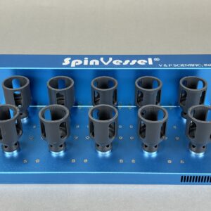 Blue laboratory rack with multiple black cylindrical spin vessels held in circular slots, labeled SpinVessel on the top cover.