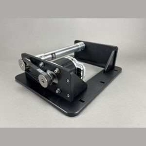 Small motorized linear actuator on a black base with belt-driven pulleys and a silver guide rod.